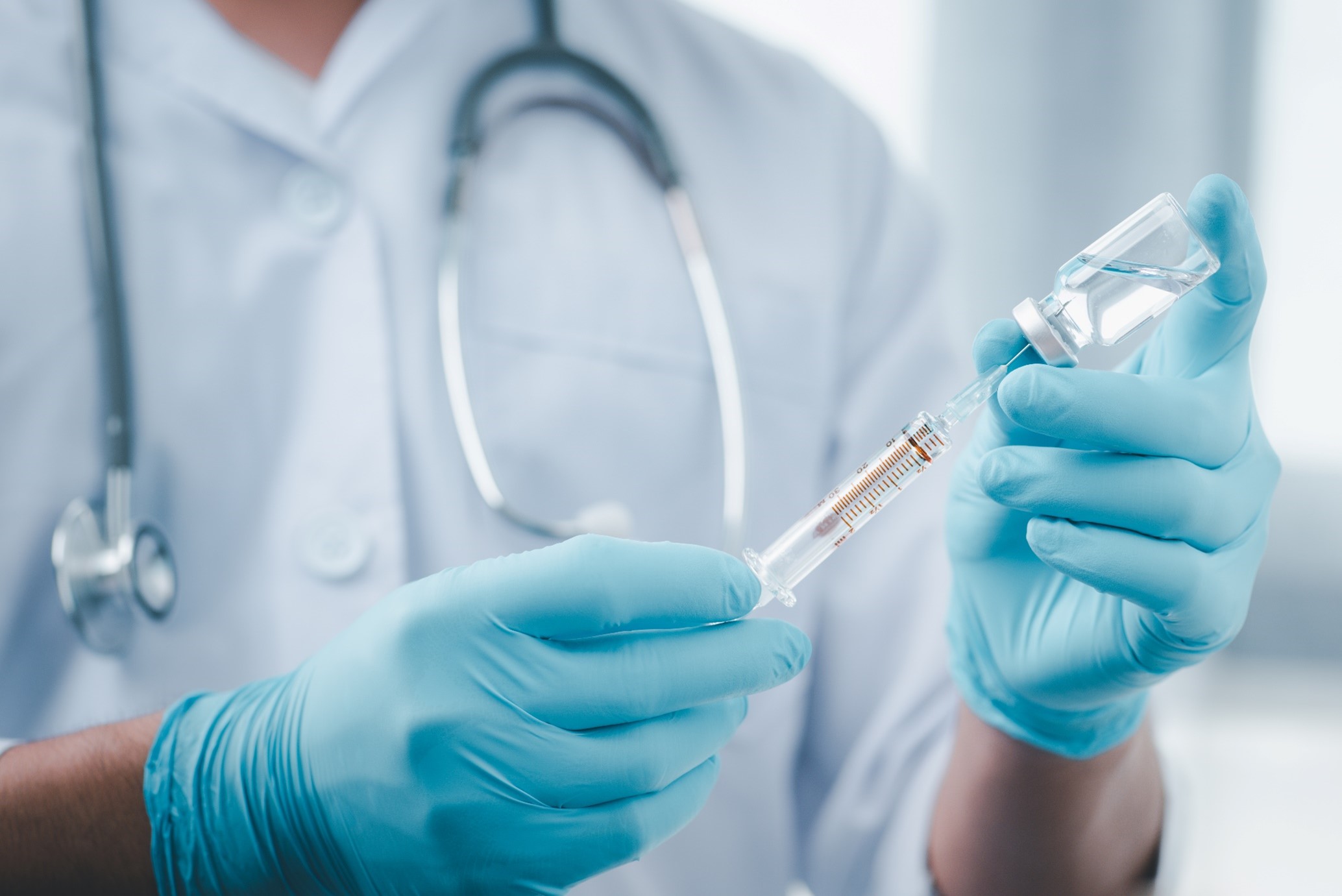 Medical professional with syringe