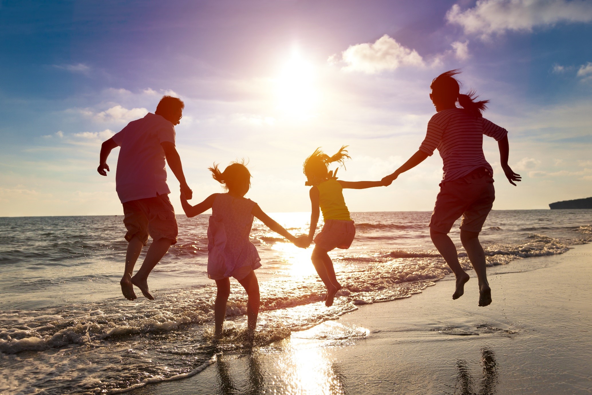 Family playing at the beach