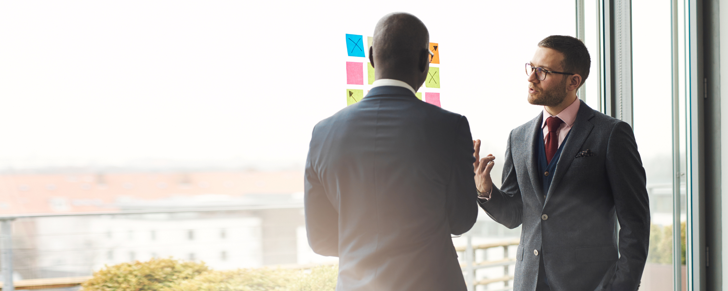 Private equity executives reviewing investment performance and carried interest returns.